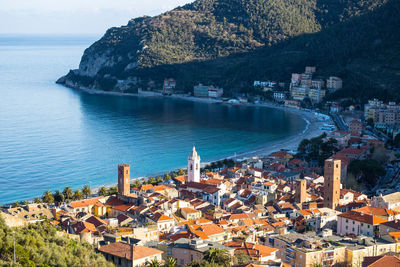 High angle view of buildings by sea