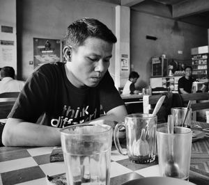 Portrait of a man with drink in restaurant
