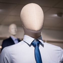 Low angle close-up of mannequin at clothing store