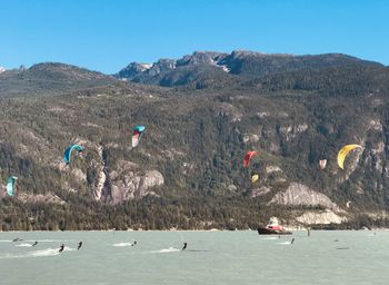 Scenic view of mountains against clear sky kite surfing