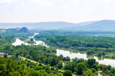 High angle view of trees and mountains against sky