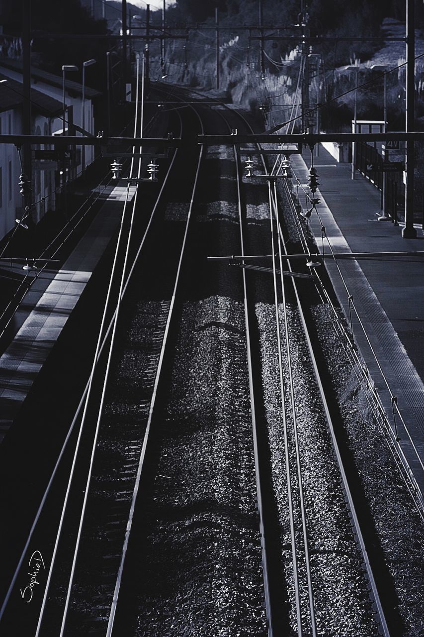 railroad track, rail transportation, transportation, public transportation, railway track, no people, railway signal, cable, night, outdoors, train station