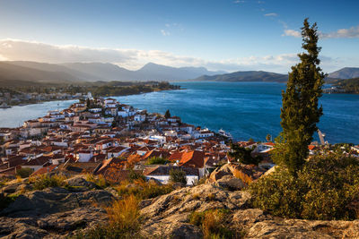 High angle view of townscape by sea