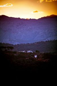 Scenic view of mountains against sky during sunset