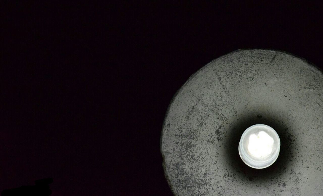 LOW ANGLE VIEW OF ILLUMINATED LAMP AGAINST CLEAR SKY