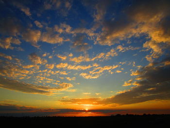 Scenic view of dramatic sky during sunset