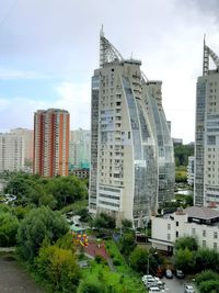 Buildings in city against sky