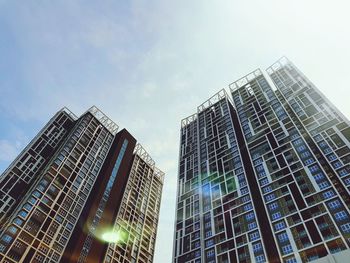 Low angle view of modern buildings against sky