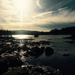 Scenic view of river at sunset