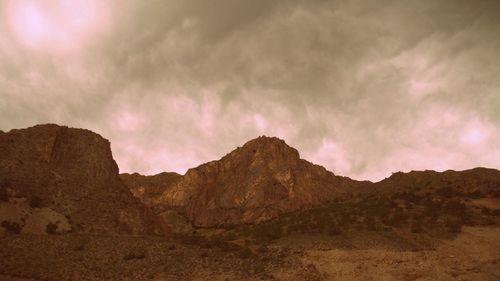 Scenic view of mountains against dramatic sky