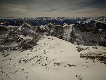 Aerial view of snow covered landscape by night