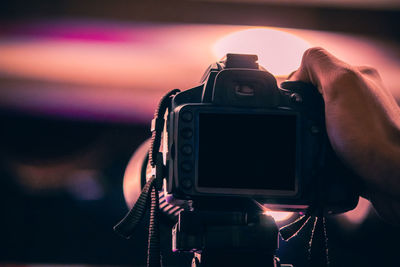 Close-up of hand holding camera