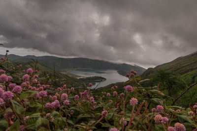 Scenic view of mountains against cloudy sky