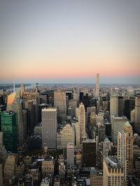 Cityscape against sky during sunset