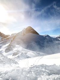 Sun behind the mountain on the hintertux glacier