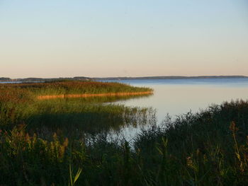 Scenic view of lake against sky during sunset