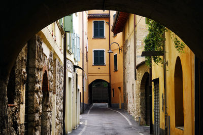 Narrow alley amidst buildings in town