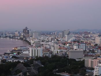 High angle view of buildings by sea against sky