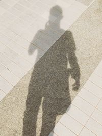 Shadow of people on street