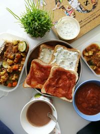 Directly above shot of food and drink on table at home