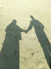 Shadow of man on beach