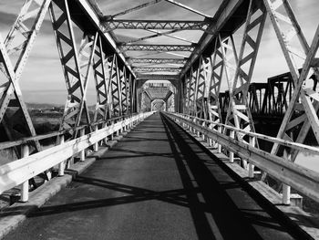 Metallic bridge against sky