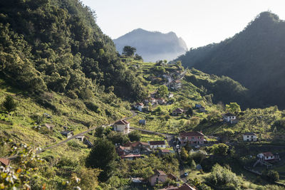 Scenic view of townscape against mountains