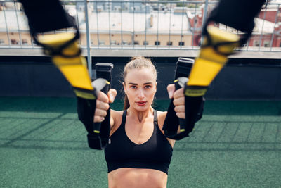 Portrait of woman exercising in gym