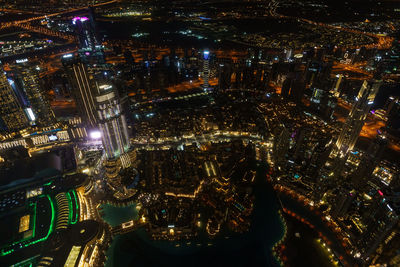 High angle view of illuminated city buildings at night