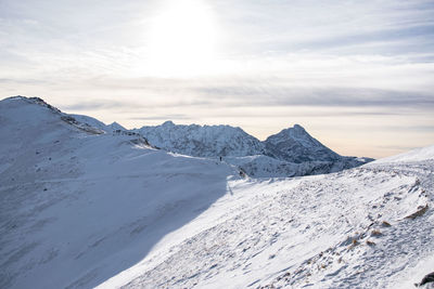Scenic view of snowcapped mountains against sky