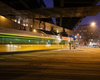 Illuminated city street at dusk