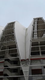 Low angle view of tall building against clear sky