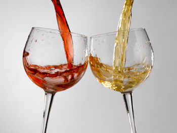 Close-up of wine glass against white background