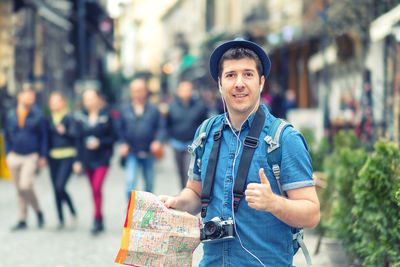 Portrait of young man standing outdoors