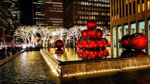 Illuminated christmas decoration in city at night