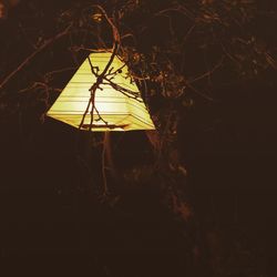 Silhouette of telephone at night