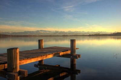 Scenic view of lake against cloudy sky