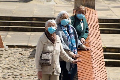 Group of women travelling. famous historic bridge of boyaca in colombia. colombian independence .