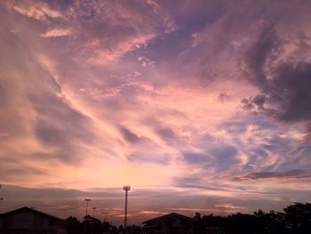 Low angle view of silhouette trees against sky at sunset