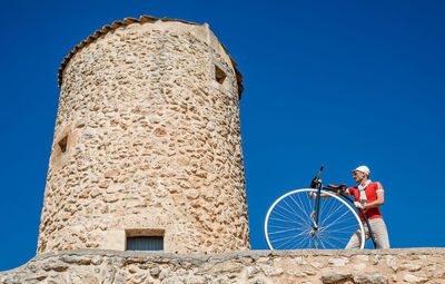 Low angle view of tower against clear blue sky