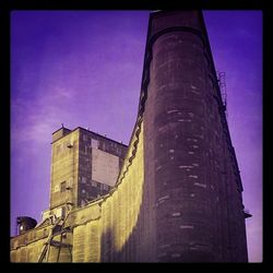 Low angle view of built structure against blue sky