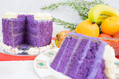 Close-up of cake and fruits on table during christmas