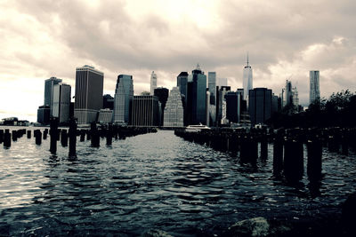 City skyline against cloudy sky