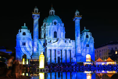 Illuminated buildings in city at night