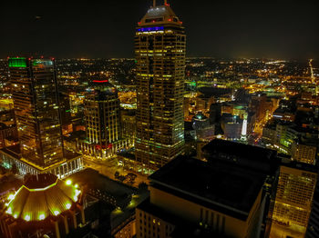 High angle view of illuminated buildings in city at night