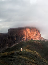 Rock formation on land against sky