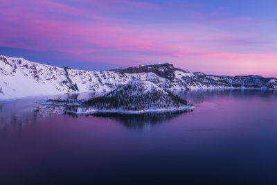 Scenic view of lake against sky during winter