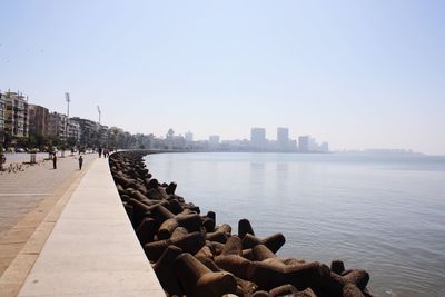 Panoramic view of river by buildings against clear sky