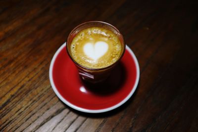 High angle view of cappuccino in cup on table