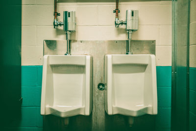 Urinals in public restroom